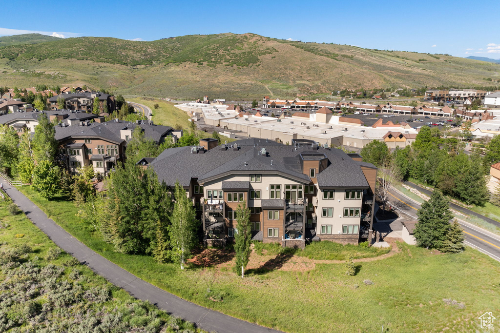 Aerial view of residential area featuring a mountain backdrop