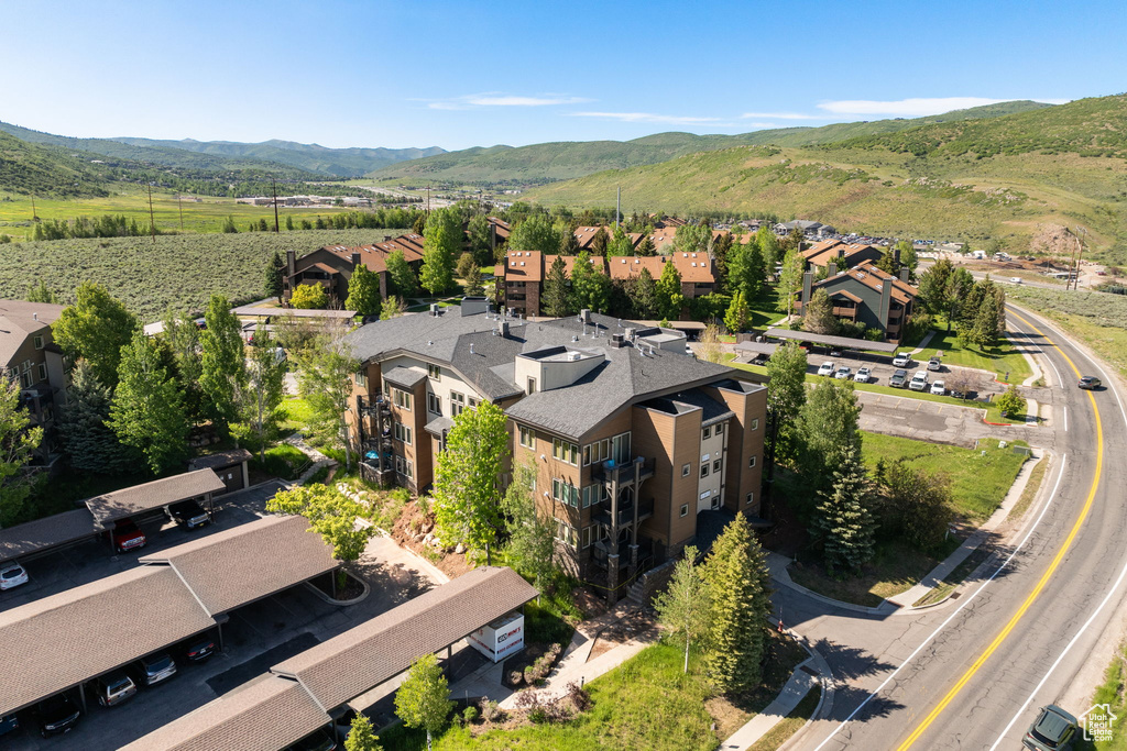 Aerial view of residential area featuring a mountainous background