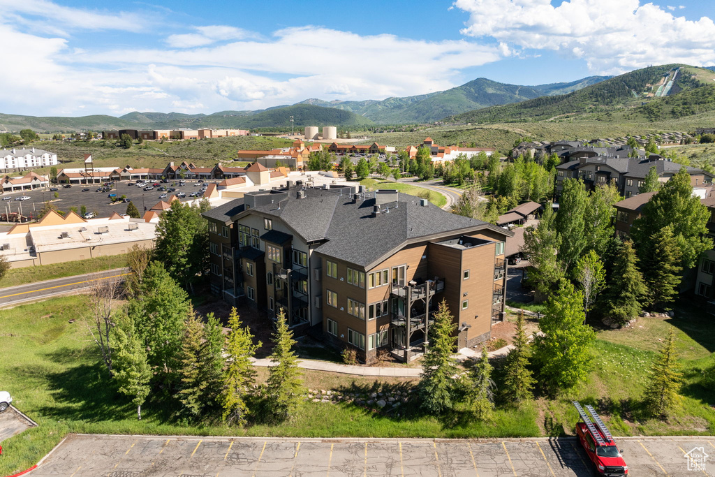 Aerial view of residential area featuring a mountainous background