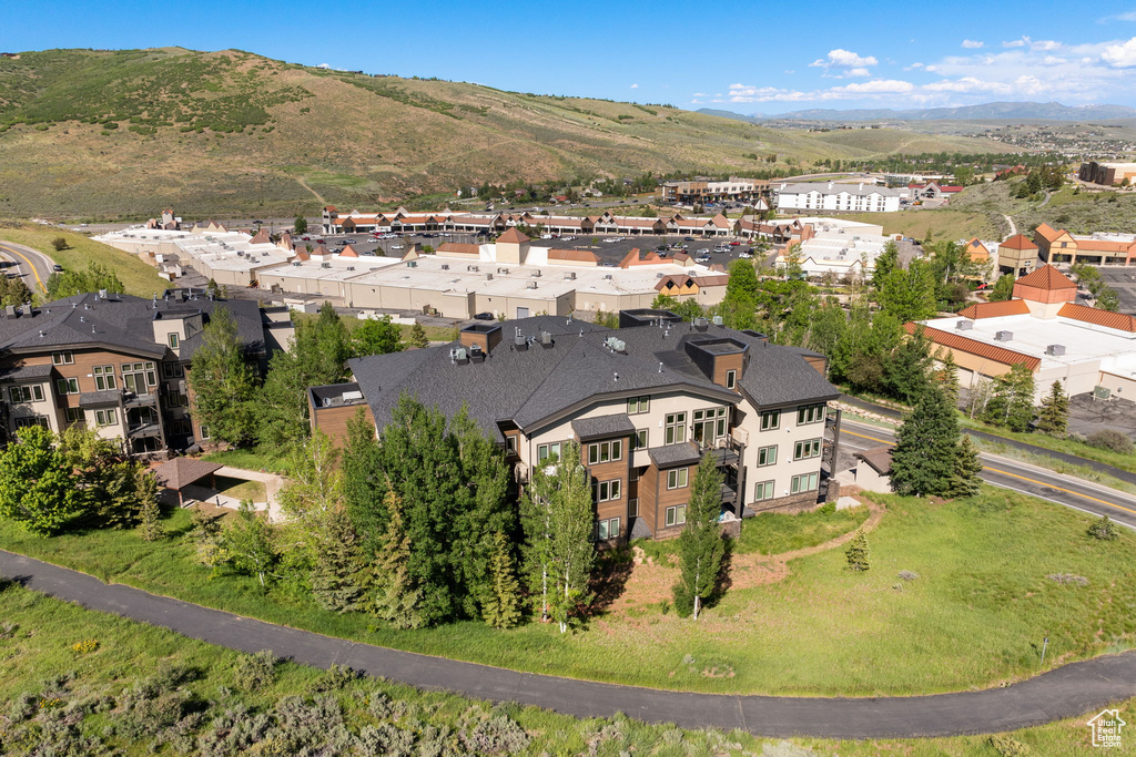 Aerial perspective of suburban area with a mountainous background