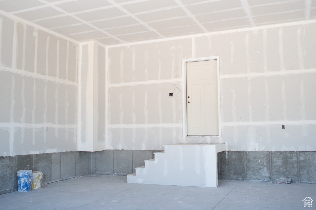Stairway featuring concrete flooring