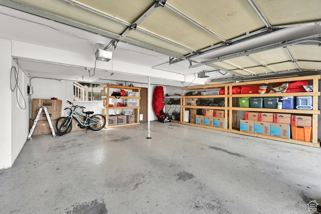 Garage featuring a garage door opener