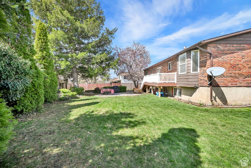 View of yard featuring fence