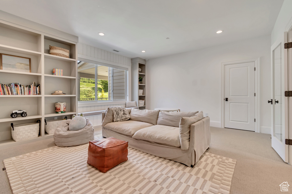 Living room featuring light carpet and recessed lighting