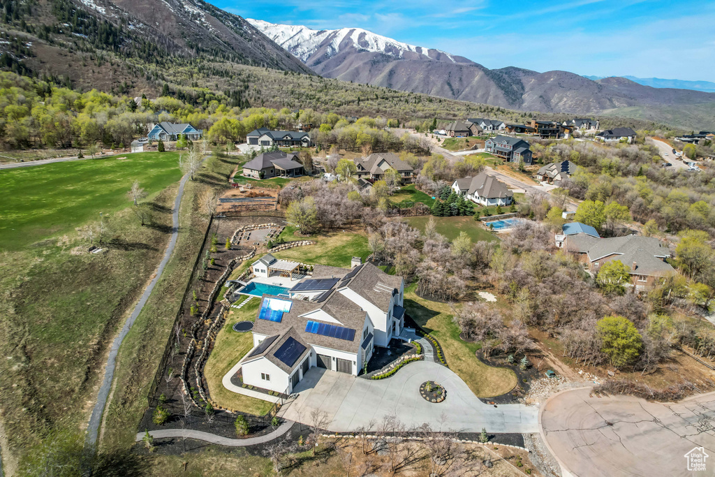 Aerial overview of property\'s location with nearby suburban area and mountains