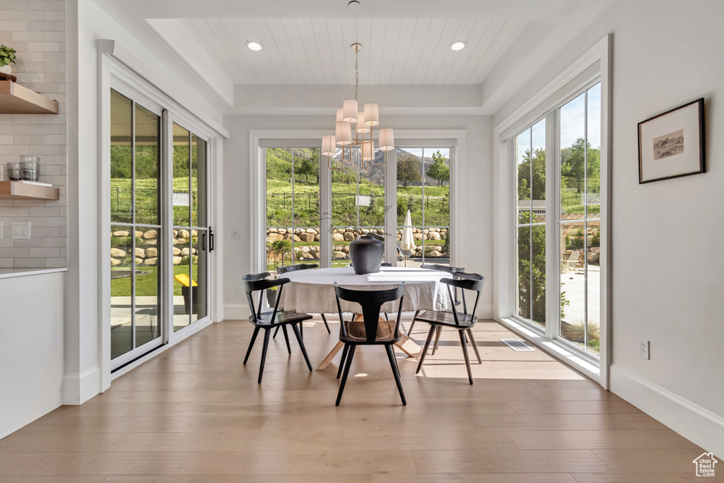 Sunroom with a chandelier