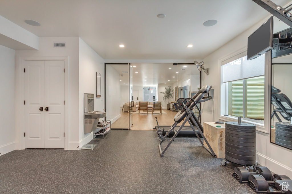 Workout room with baseboards and recessed lighting