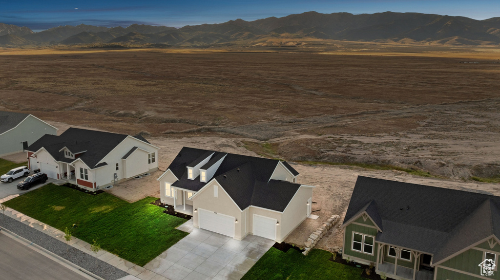 View of rural area featuring mountains and a desert landscape