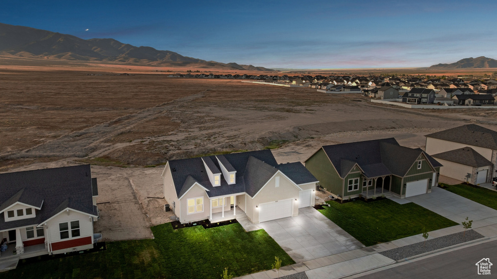Aerial view of residential area featuring a mountainous background
