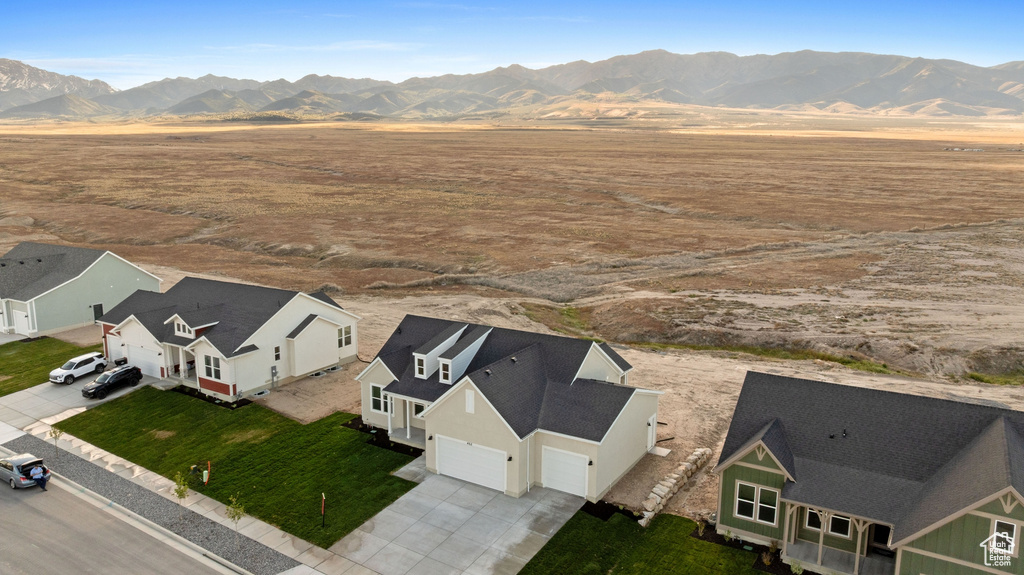 Aerial view of sparsely populated area with a mountainous background