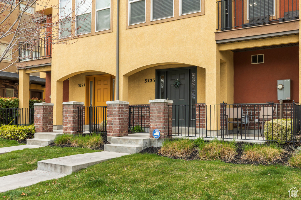 Property entrance with stucco siding