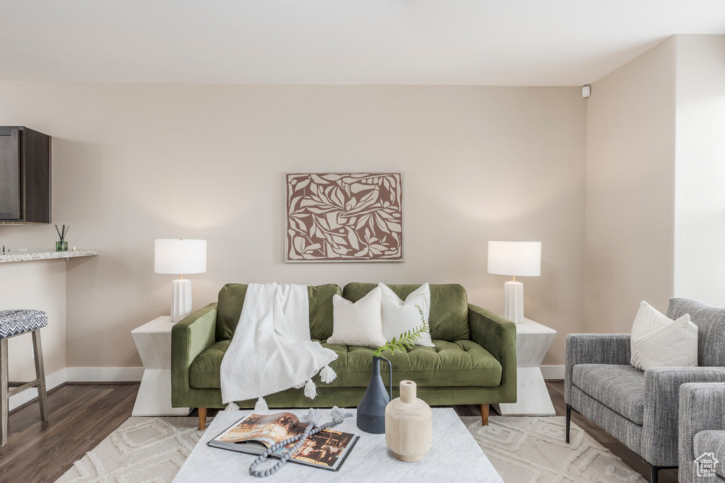 Living area featuring light wood-style floors and baseboards