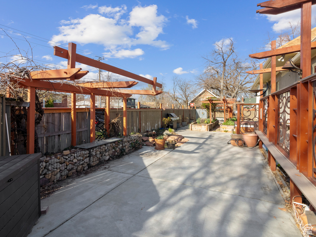 View of patio / terrace with a pergola and a fenced backyard
