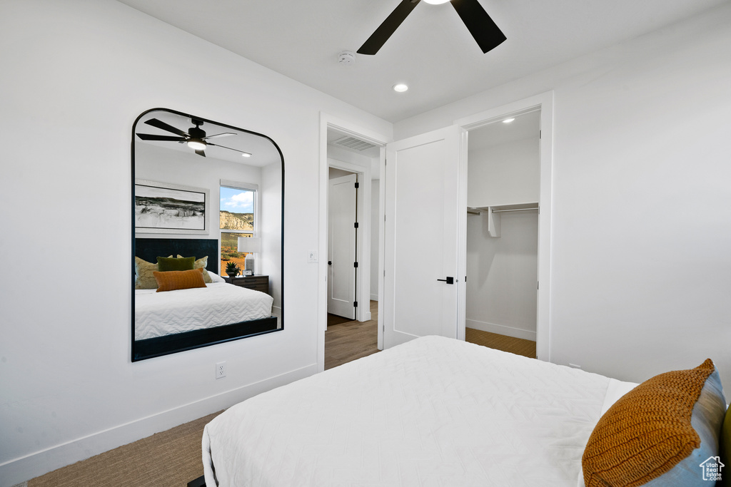 Bedroom with recessed lighting, ceiling fan, and baseboards