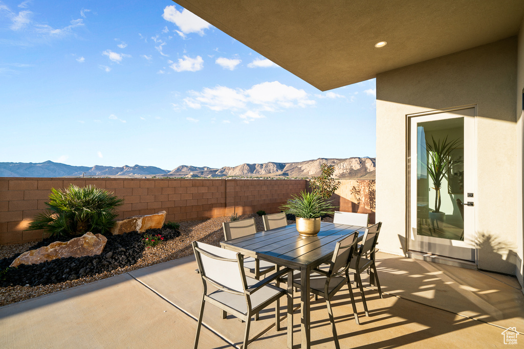 View of patio / terrace with outdoor dining area and a mountain view