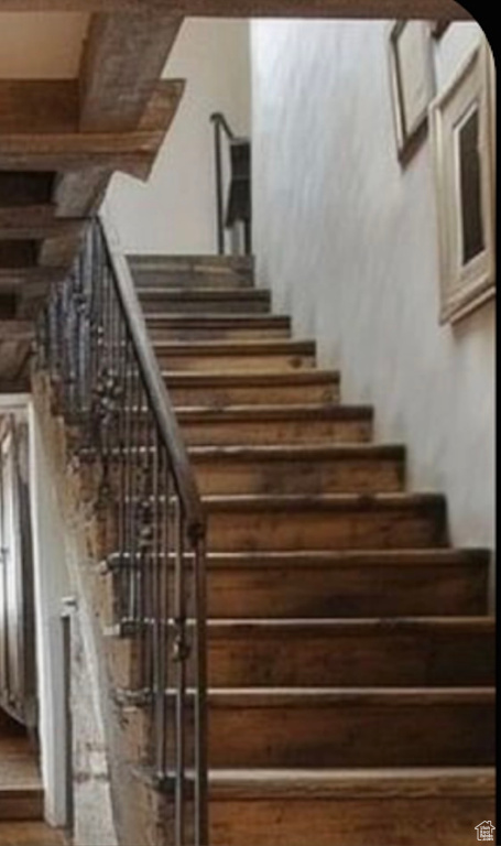 Staircase with wood finished floors