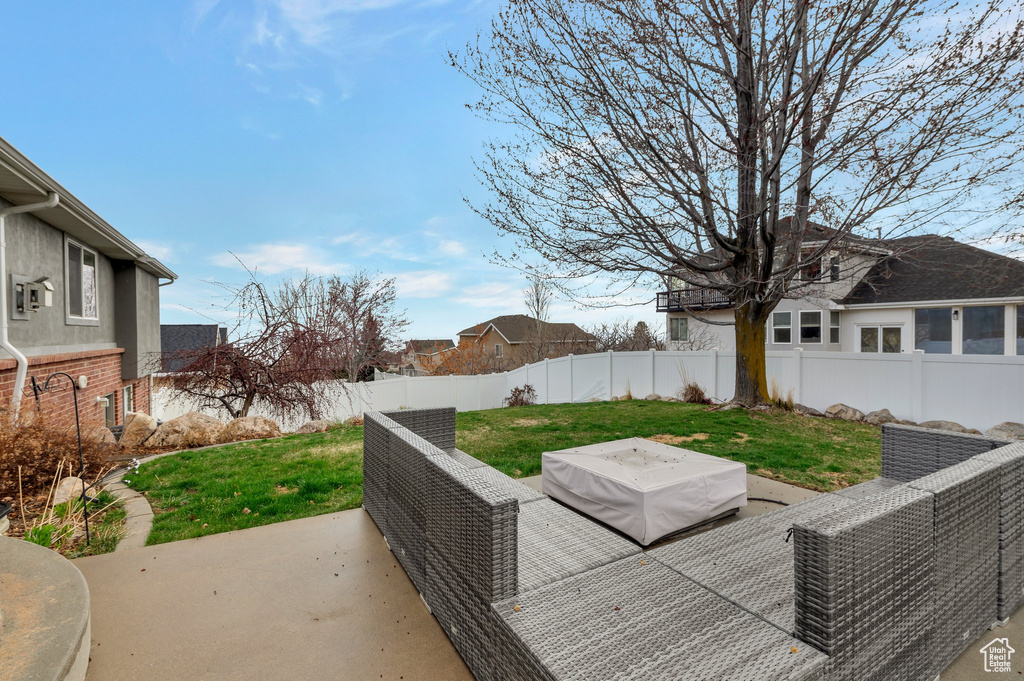 Exterior space featuring an outdoor living space and a fenced backyard