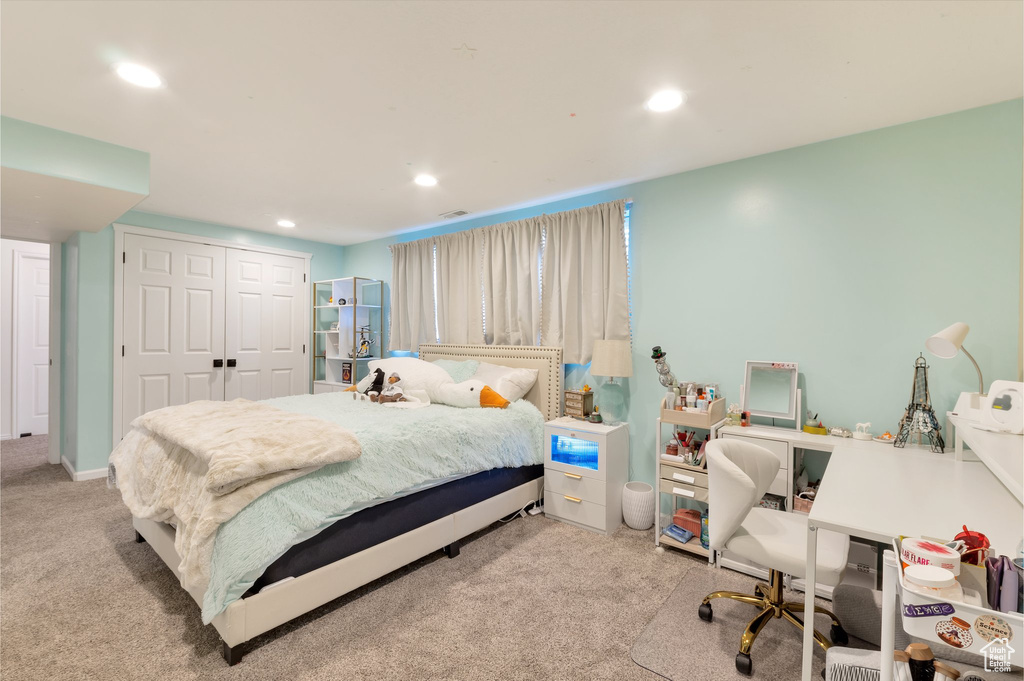 Carpeted bedroom featuring a closet and recessed lighting
