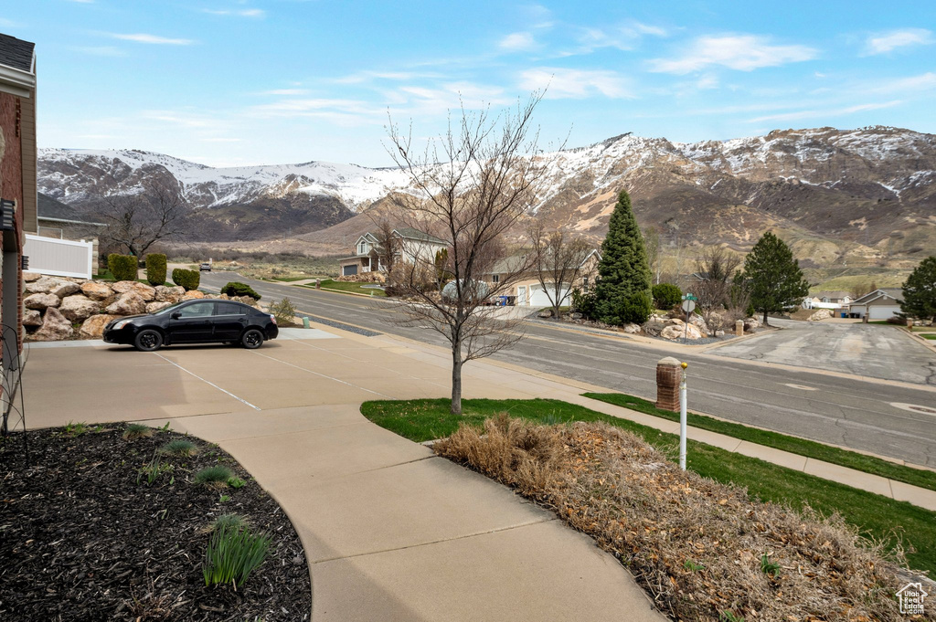 View of road with sidewalks and a mountain view