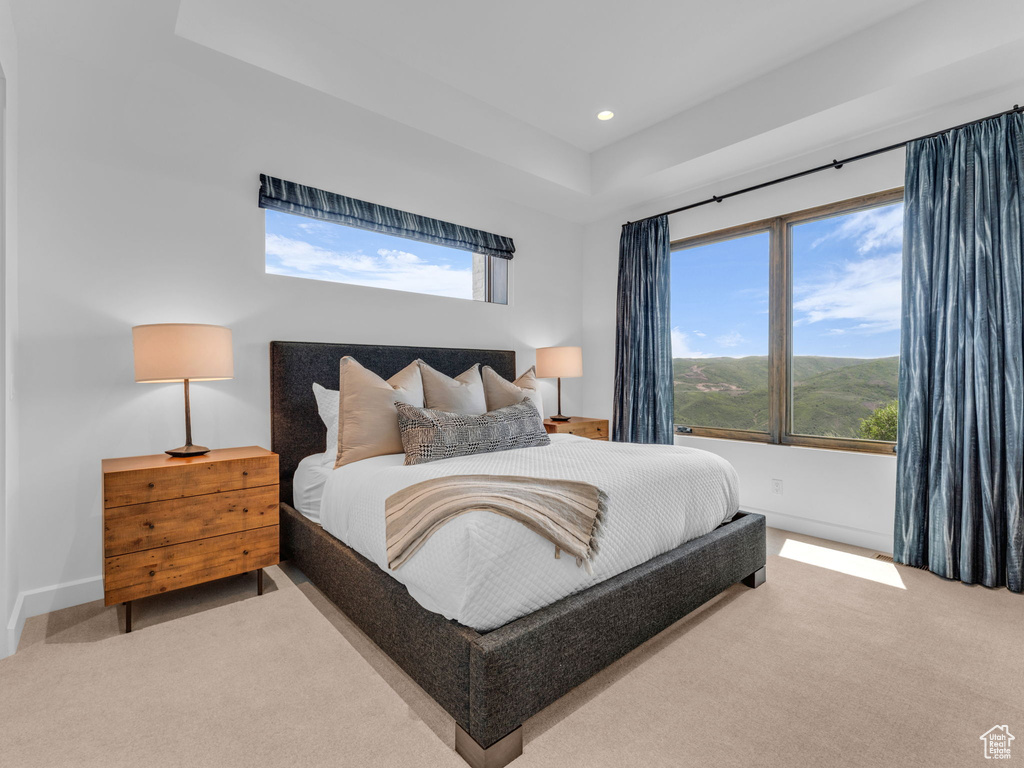 Carpeted bedroom with recessed lighting and baseboards