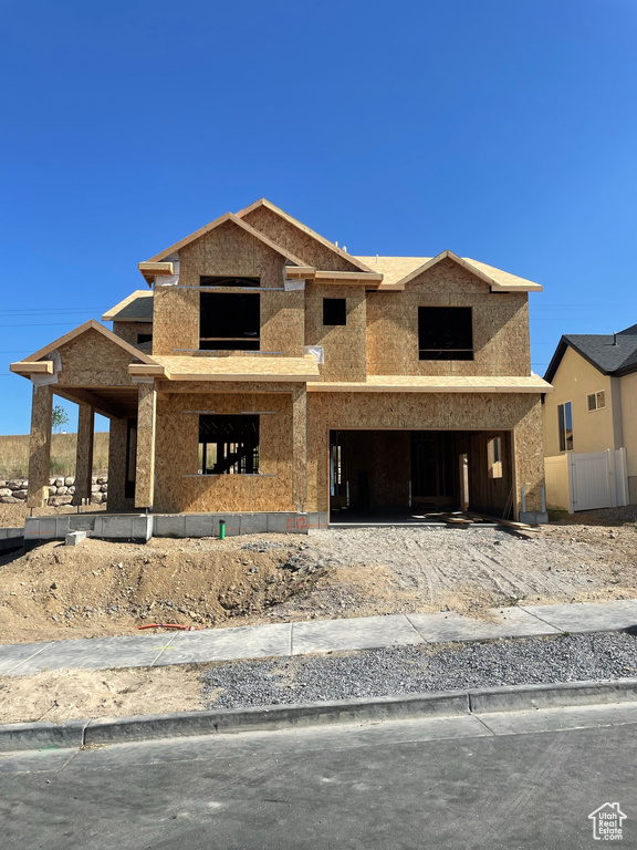 Property under construction featuring a garage