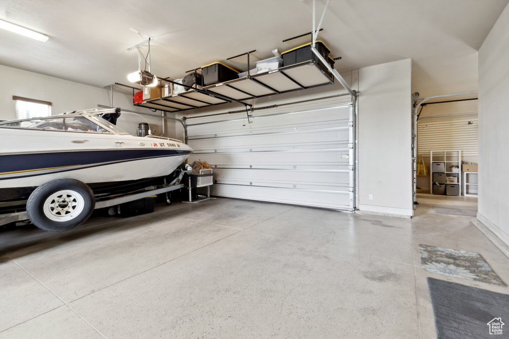 Garage featuring a garage door opener