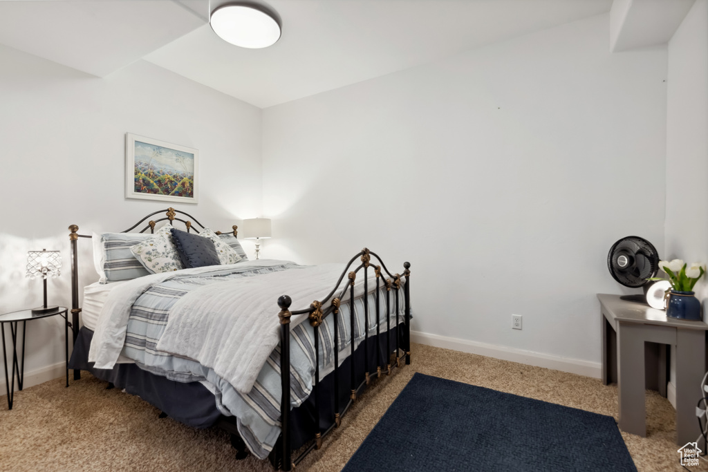 Carpeted bedroom with baseboards
