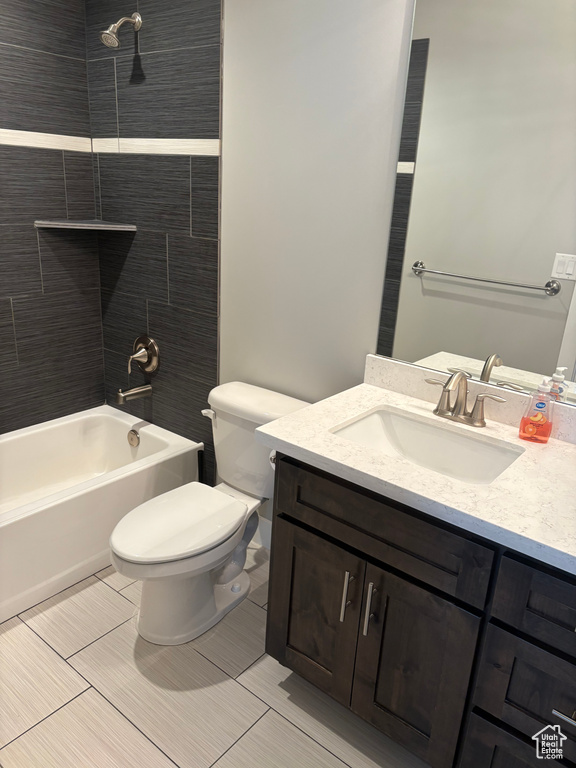 Bathroom featuring vanity and  shower combination