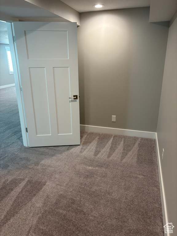 Spare room featuring carpet and recessed lighting