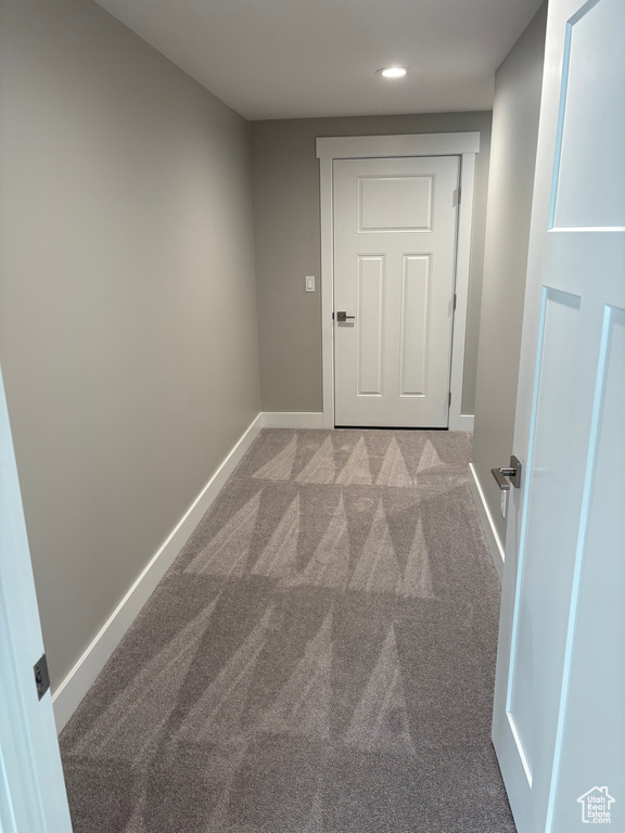 Corridor with carpet and recessed lighting