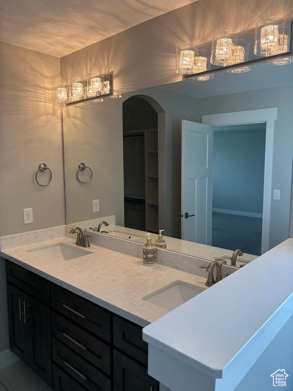 Full bath featuring double vanity