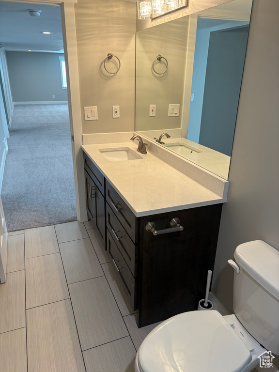 Bathroom with vanity and toilet
