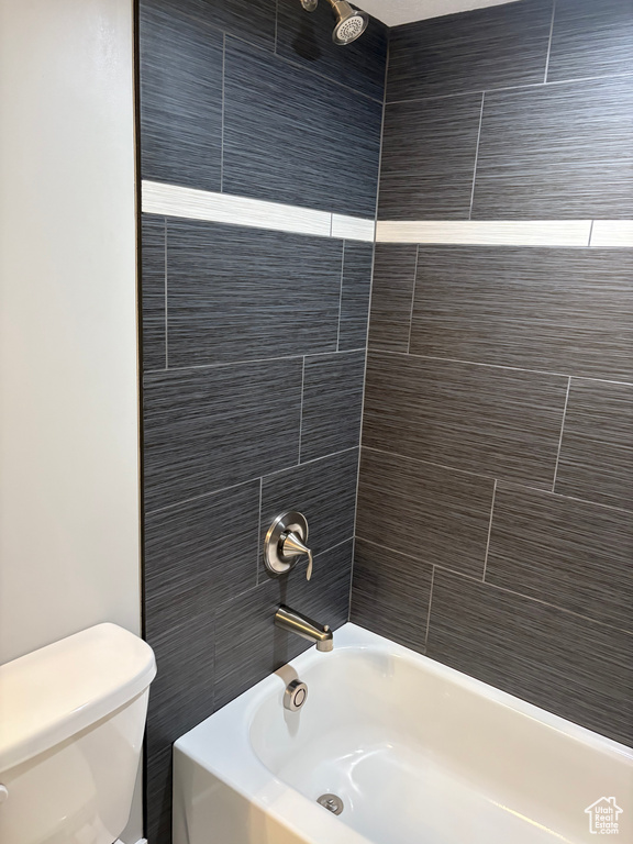 Full bathroom with toilet and shower / tub combination