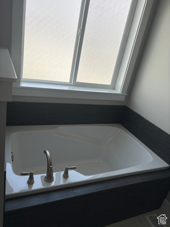 Full bathroom with a garden tub