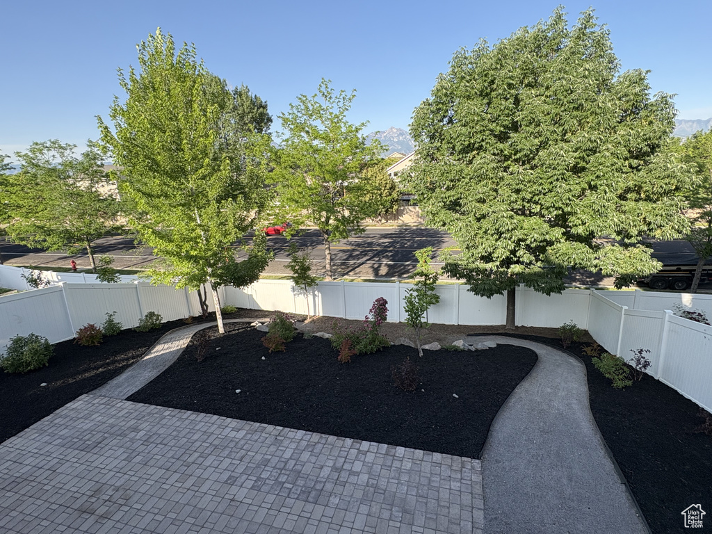 Fenced backyard with a patio area