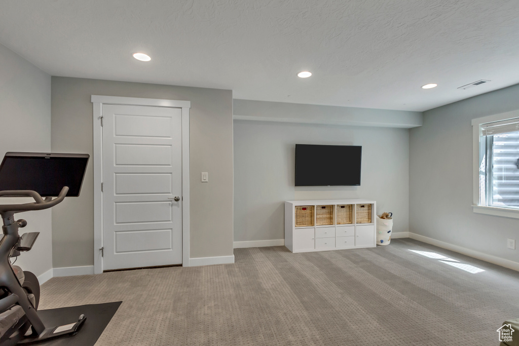 Exercise room with recessed lighting, baseboards, visible vents, and carpet floors