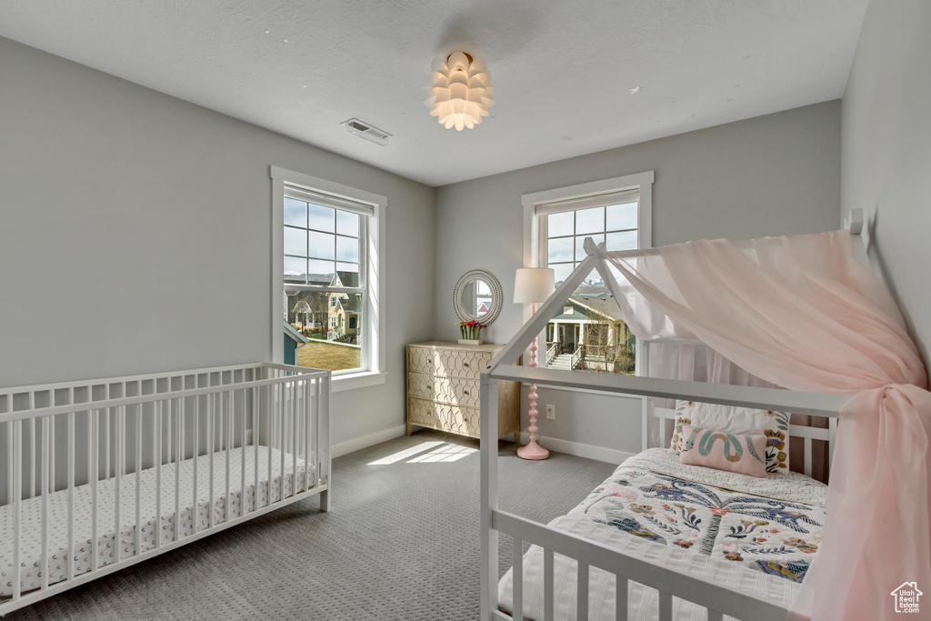 Carpeted bedroom with baseboards