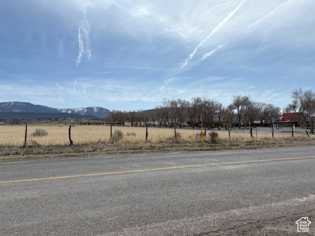View of street featuring a rural view and a mountain view