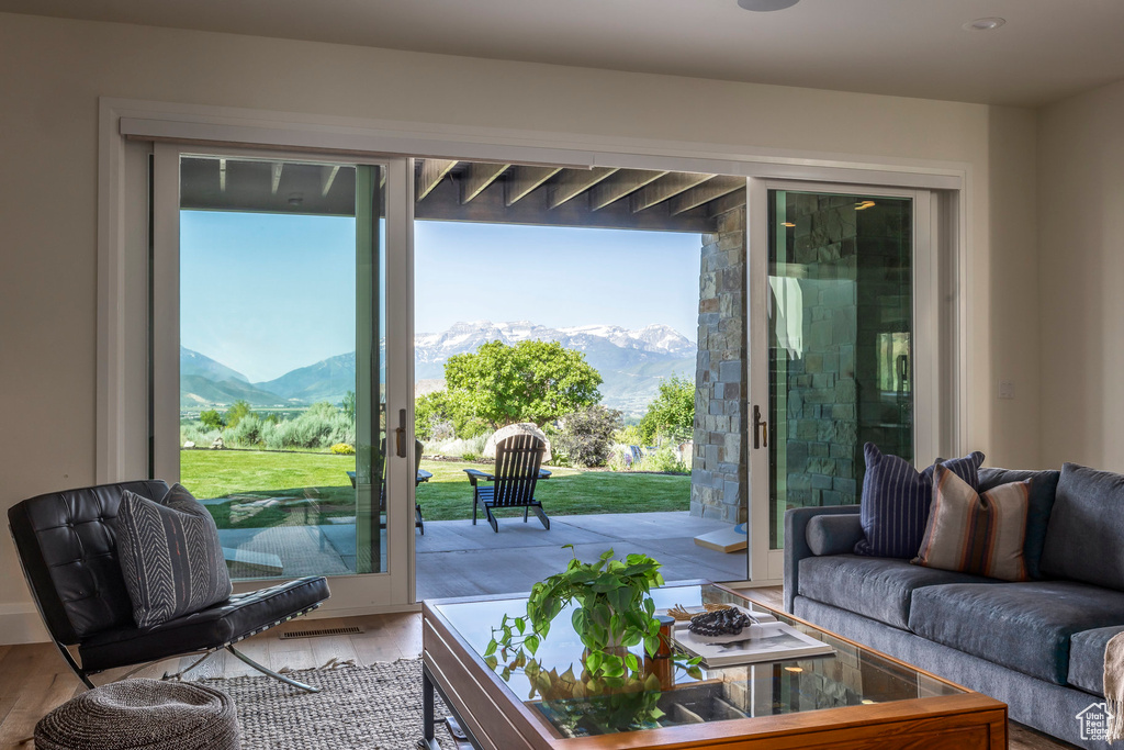 Living room featuring a mountain view and wood finished floors