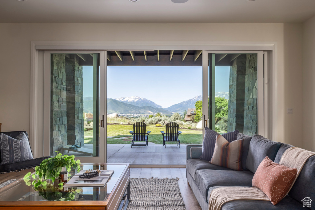 Living room with a mountain view and wood finished floors