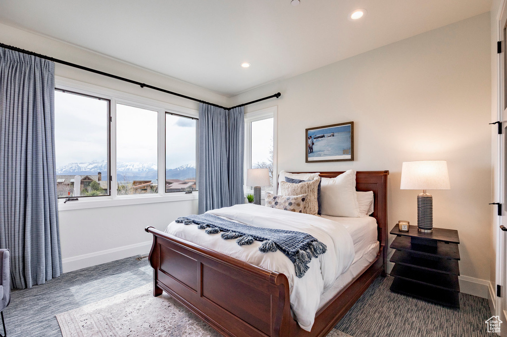Bedroom with baseboards, multiple windows, and recessed lighting