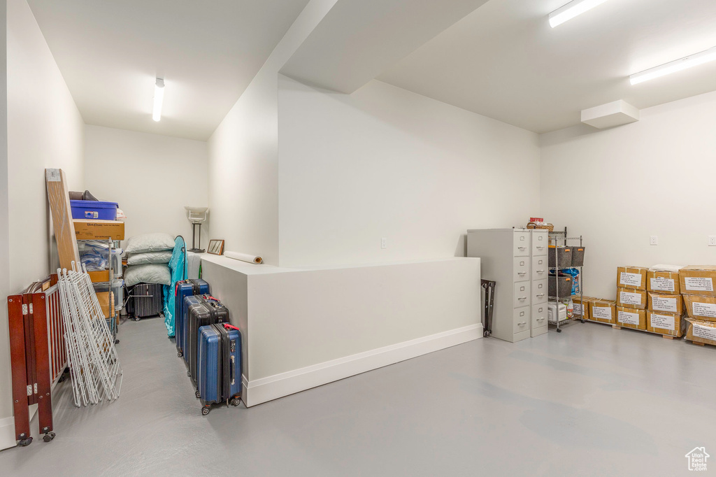 Garage featuring baseboards