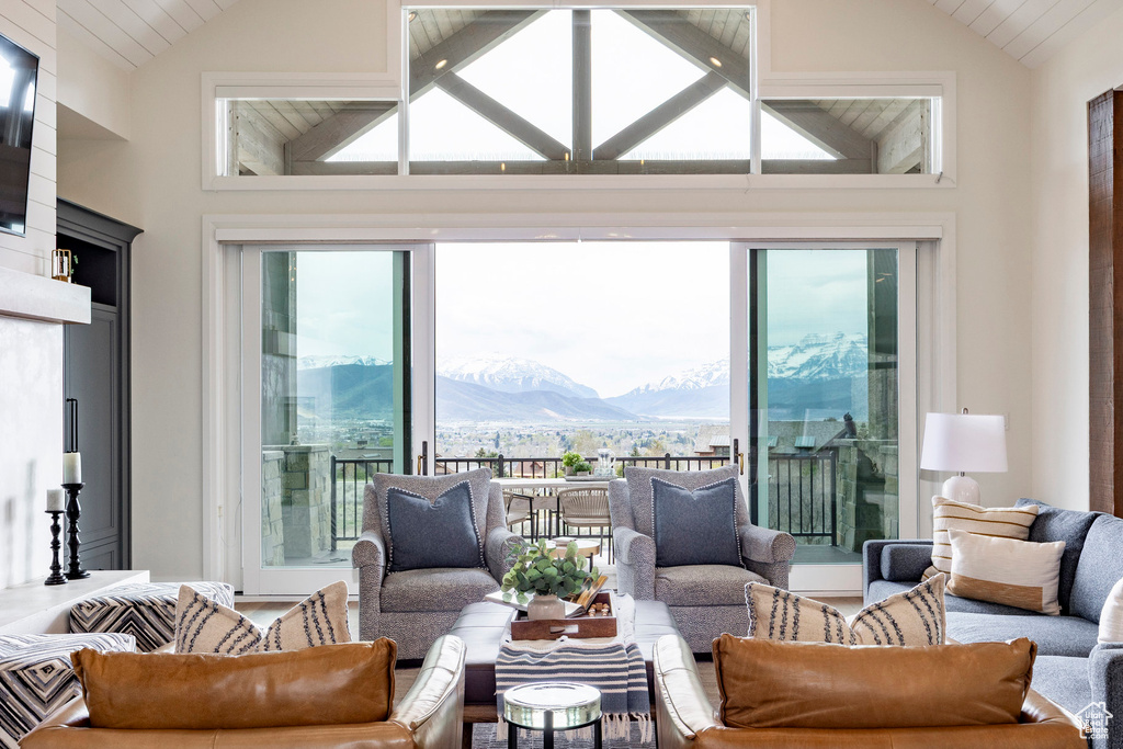 Living room featuring a mountain view and high vaulted ceiling