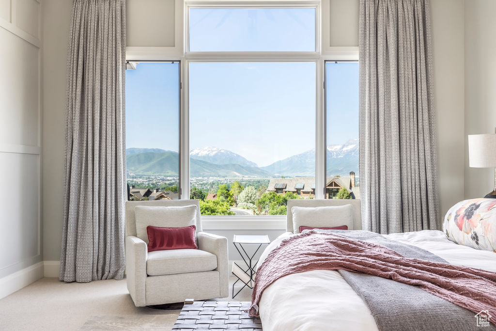 Bedroom featuring a mountain view and carpet floors