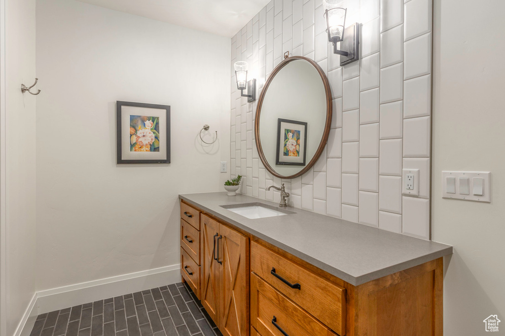 Bathroom featuring vanity and baseboards