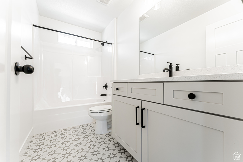 Full bathroom featuring vanity, tub / shower combination, and tile patterned floors