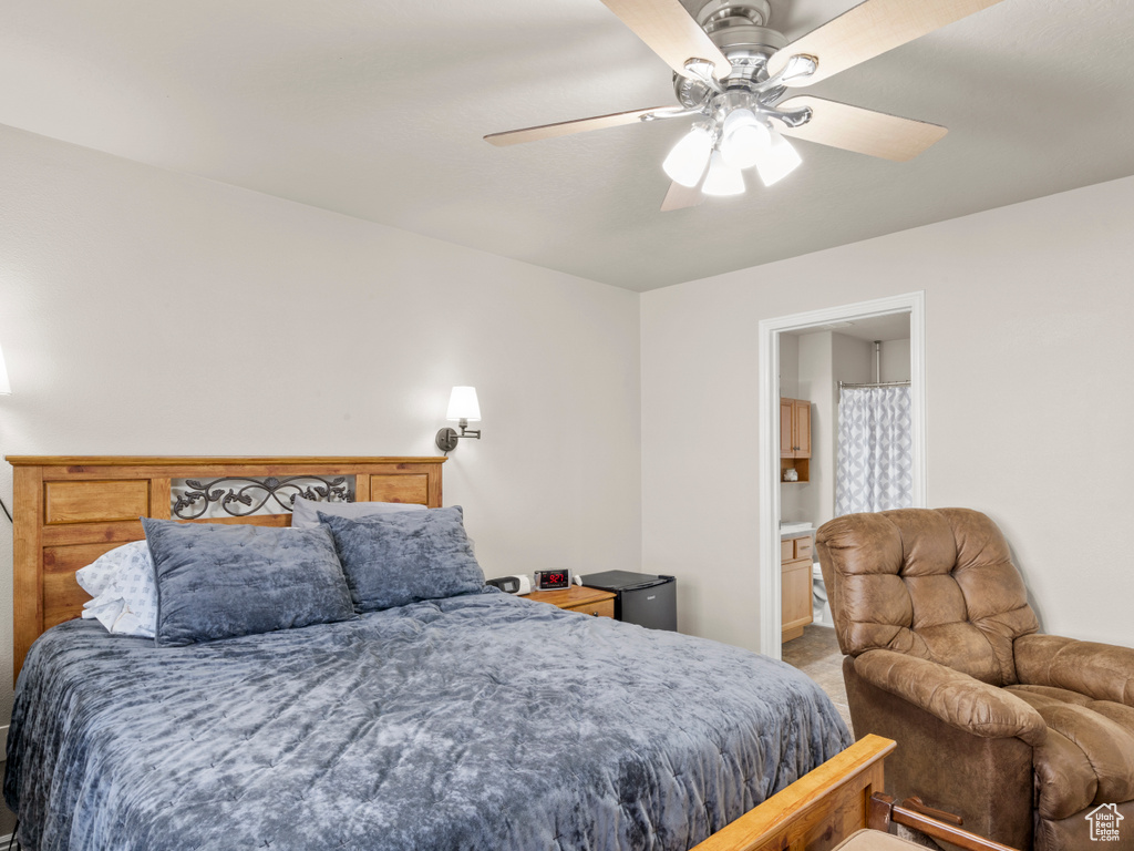 Bedroom featuring ceiling fan and connected bathroom