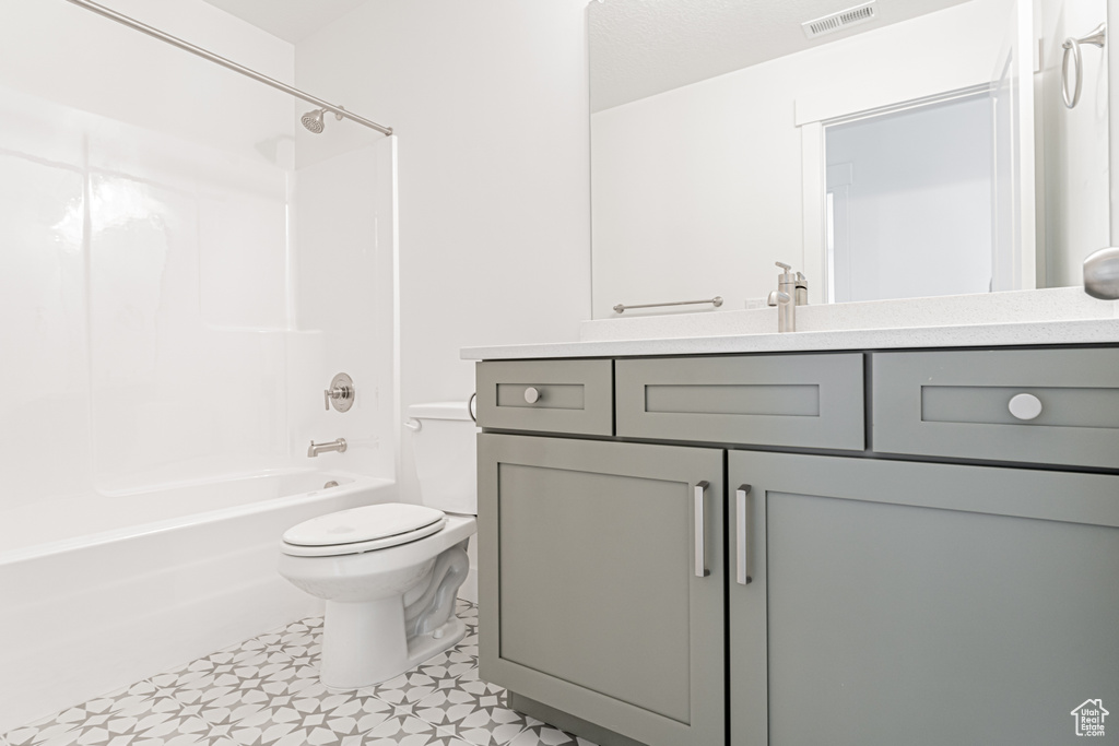 Bathroom featuring vanity and bathtub / shower combination