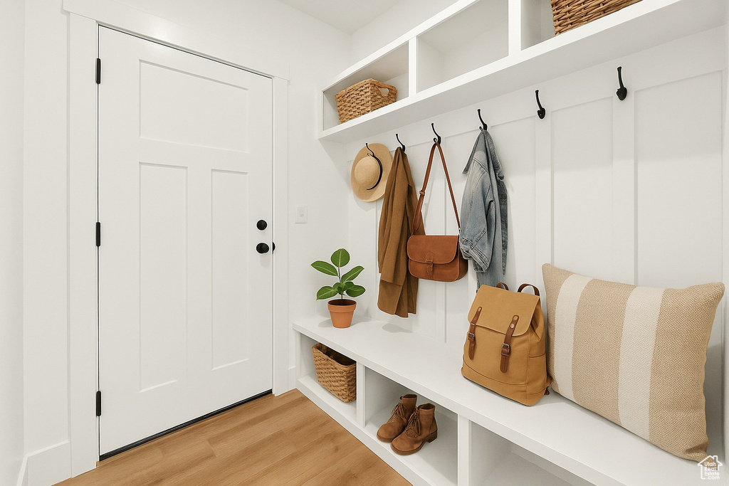 Mudroom featuring light wood-style floors