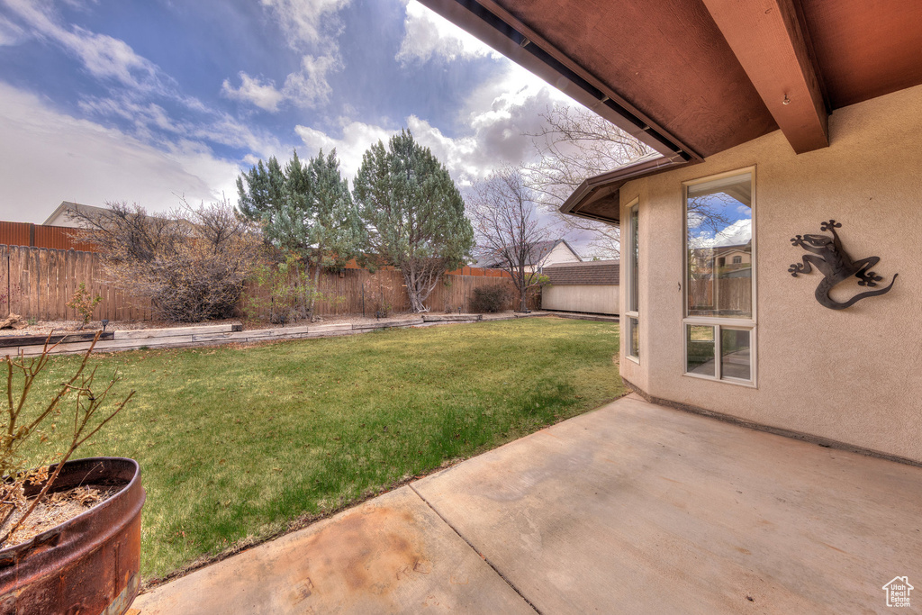 View of yard featuring a patio and a fenced backyard